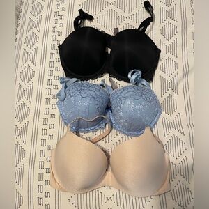34DD Victoria Secret bras. Black never worn w/ tags. Nude & baby blue, like new.